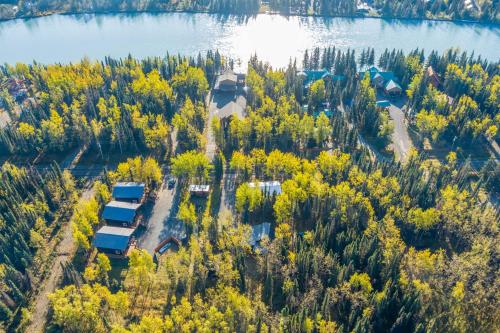 an aerial view of a house on the shore of a lake at Studio Steps to Kenai River with Fire Pit! in Sterling