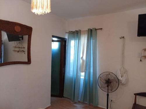 TV a/nebo společenská místnost v ubytování Casa iguana-home away