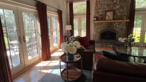 a living room with a couch and a fireplace at Fresh Pond East in Plymouth