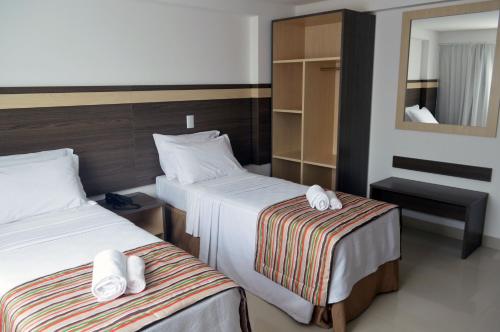 Uma cama ou camas num quarto em Val Atlantic Hotel