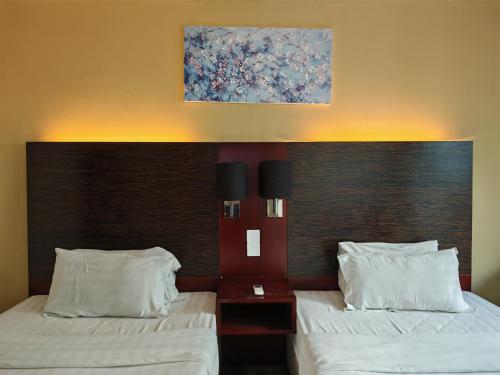 Katil atau katil-katil dalam bilik di Meetsuite at Ming Garden Residence