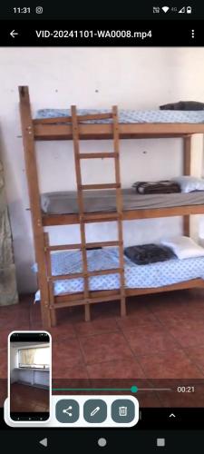 a cell phone screenshot of a room with two bunk beds at Casa de la cúpula in Morelia