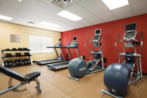 a gym with several tread machines in a room at Courtyard Salt Lake City Layton in Layton