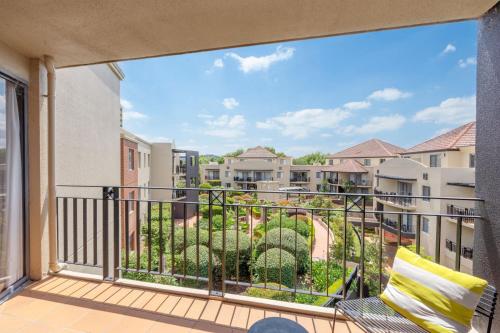 a balcony with a view of condos at Sleek 2-Bed Apartment in Vibrant Kingston in Kingston 