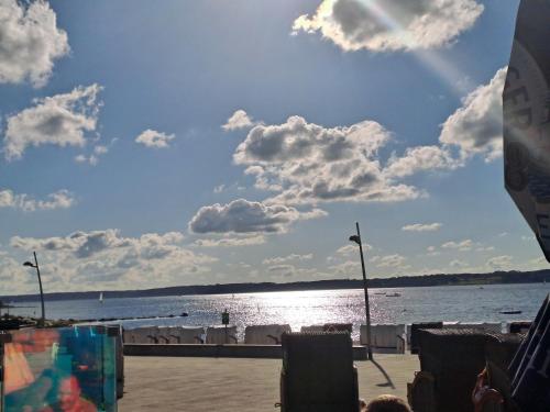 a view of a body of water with clouds in the sky at Ferienwohnung GlüXX in Ulstrupfeld