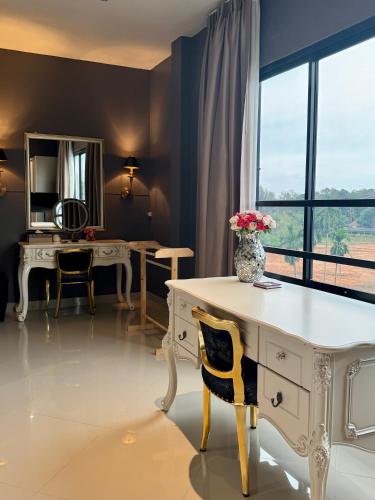 a room with a white desk and a mirror at Klong Muang Beach Apartment in Klong Muang Beach