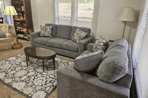 a living room with a couch and a table at Moody Woods in Orange Park