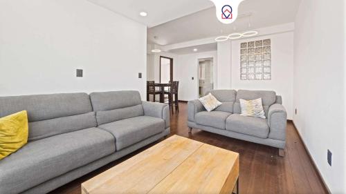a living room with a couch and a coffee table at Spacious Apartment with 2 Bedrooms in CDMX in Mexico City