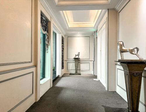 a hallway with a console in the middle of a room at All-Ur Boutique Motel - Taichung Branch in Taichung