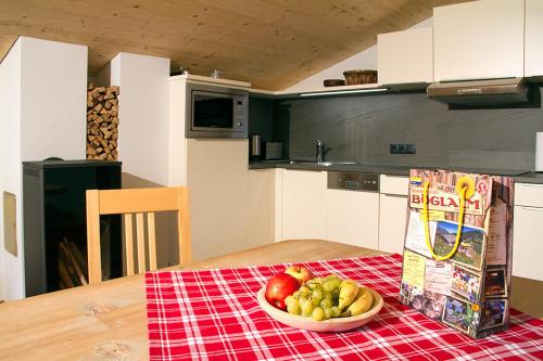 a bowl of fruit on a table in a kitchen at Appartements Innerthal in Inneralpbach