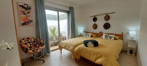 Ένα ή περισσότερα κρεβάτια σε δωμάτιο στο Casa Olisa