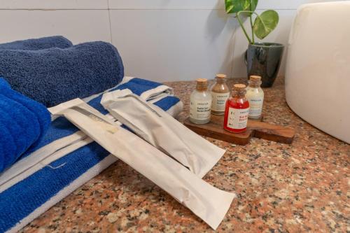 a pile of towels and bottles on a counter at Gopagiri Homestay - Gwalior in Gwalior