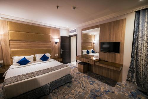 Postel nebo postele na pokoji v ubytování Ebreez Hotel