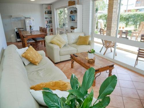 a living room with a couch and a coffee table at Arlingtons Holiday Accommodation in Portarlington