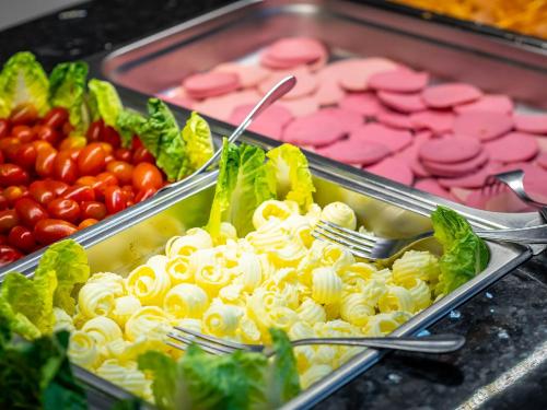 a buffet of food with pasta and other vegetables at Hotel Oudaya & Spa in Marrakech