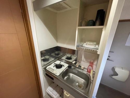 Kuchyň nebo kuchyňský kout v ubytování マルチステイ大阪京橋21