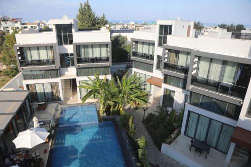 an aerial view of a building with a swimming pool at Del Mare Park in Kérynia