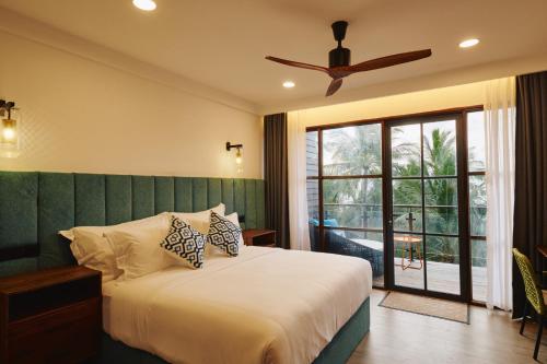 Postel nebo postele na pokoji v ubytování Beach Hotel Dhigurah