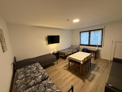 a living room with a couch and a table at Cosy, beautiful and central apartment in Karlsruhe