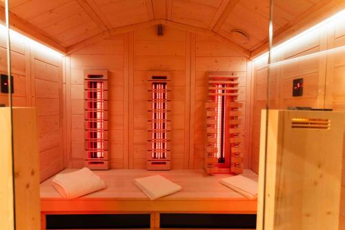 a room with four windows in a wooden room at La Chicca in pieno centro storico con SAUNA e Parcheggio gratuito in Udine