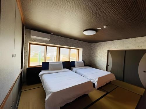 Postel nebo postele na pokoji v ubytování HOTEL COCOA RESORT