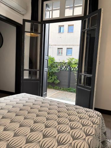 Giường trong phòng chung tại Grande maison avec beaucoup de charme centre ville de Perpignan