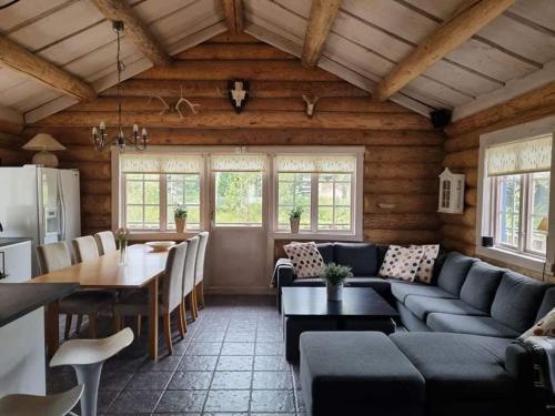 a living room with a couch and a table at Amazing Home In Sälen With 5 Bedrooms, Sauna And Wifi in Sälen
