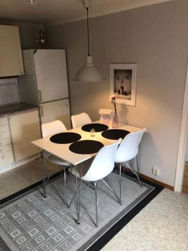 a dining room table and chairs in a kitchen at Awesome Home In Borgholm With Wifi And 0 Bedrooms in Borgholm