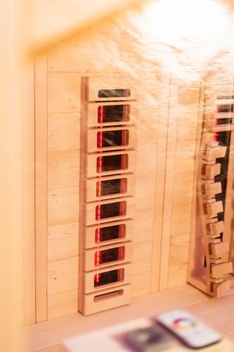 a wine rack in a wall with wine bottles at La Chicca in pieno centro storico con SAUNA e Parcheggio gratuito in Udine