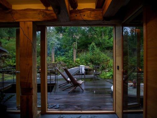 a screened in porch with a sliding glass door at Nice Home In Alingsås With 3 Bedrooms, Wifi And Sauna in Alingsås
