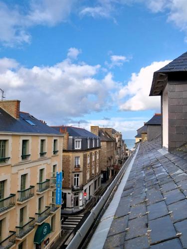 a view of a city street with buildings at Charmant appartement bord de mer in Dinard