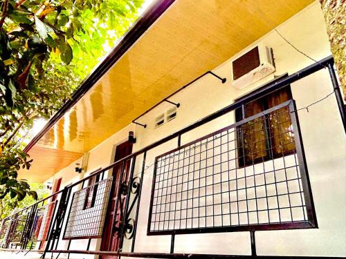 a building with a gate in front of it at D's Haven Café in La Carlota