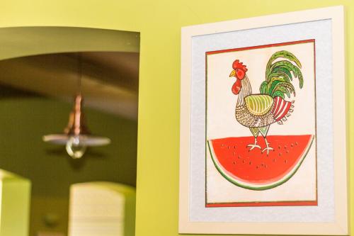 a picture of a chicken on a slice of watermelon at Ötösfogat Panzió in Siófok