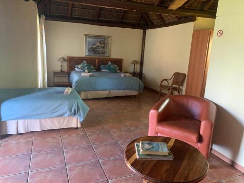 Ένα ή περισσότερα κρεβάτια σε δωμάτιο στο Rustic Fields Lodge & Venue