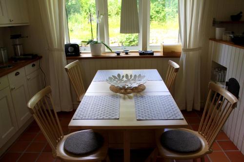 a table in a kitchen with a bowl on it at Åkagårdens Lodge in Båstad