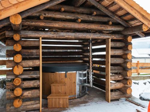 a log cabin with a wood stove in it at Farmhouse in Bramberg with Sauna & Ski Access in Dorf