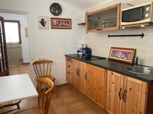 a kitchen with a sink and a counter top at Spacious villa with pool in Tarragona in Tarragona