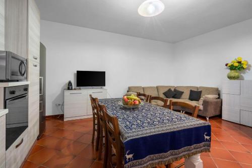 a living room with a table with a bowl of fruit on it at Borgo House In Florentine Hills With Pool in Fucecchio