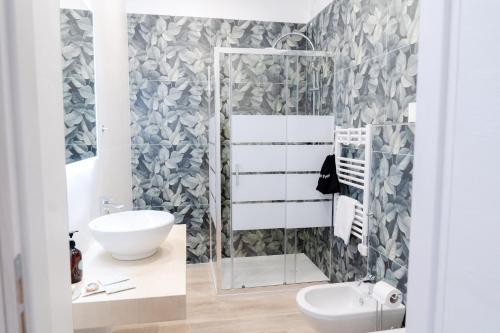 a bathroom with a toilet and a sink at InLoco - Natural Experience in Acqualagna