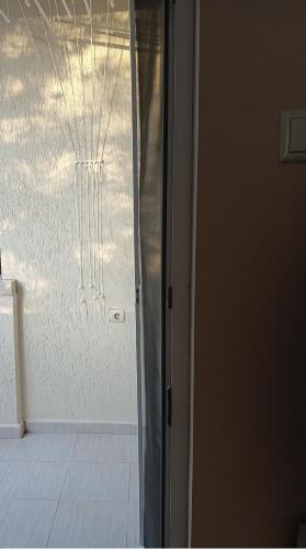 a sliding glass door to a room with a window at Apartment Andri in Yambol