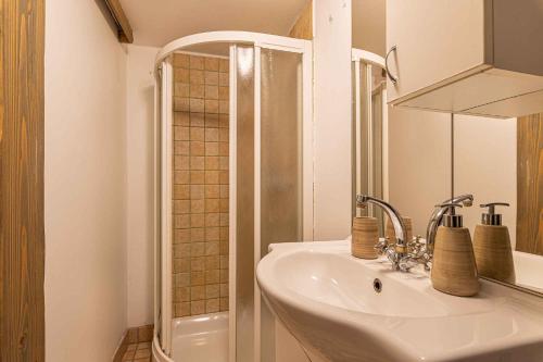 a bathroom with a sink and a shower at Holiday home in Otocec - Kranjska Krain 26039 in Otočec
