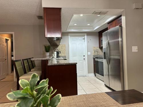 a kitchen with a stainless steel refrigerator freezer at Cozy Vacation home in Port Richey