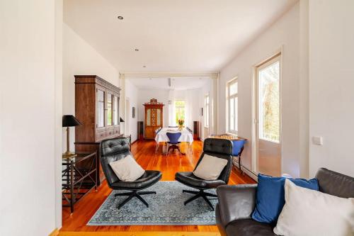 a living room with two chairs and a table at Villa Johanna in Bad Herrenalb