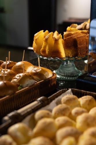 a bunch of pastries on a display in a bakery at NORTH HOTEIS in Montes Claros