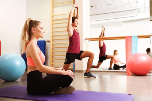 a group of people doing yoga in a gym at Hotel Vivat in Moravske Toplice