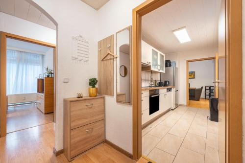 a kitchen with white walls and a large doorway at Das Spatzennest in Bad Harzburg