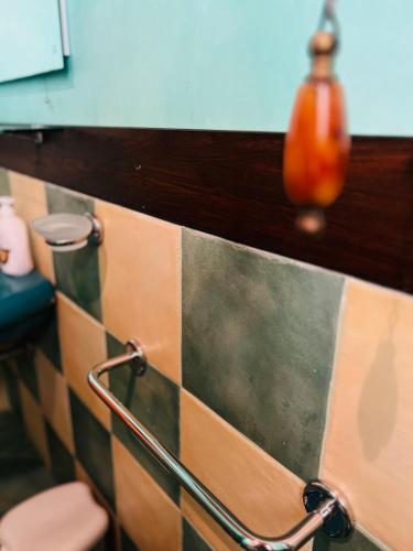 a bathroom with colorful tiles on the wall at Marnabianca Apartment in Realmonte