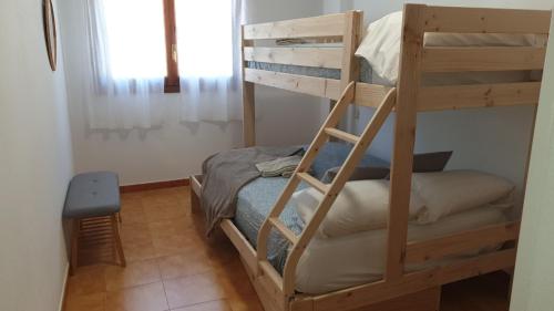 En eller flere senge i et værelse på Apartamento Loira Villanúa