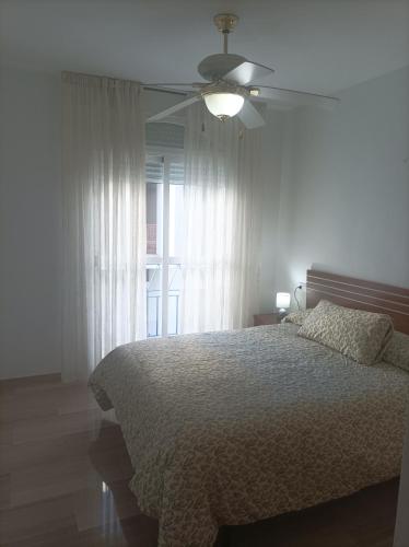 Ένα ή περισσότερα κρεβάτια σε δωμάτιο στο APARTAMENTO1 dormitorio