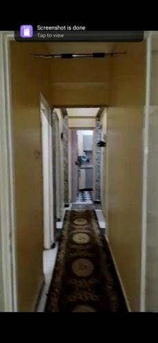 a hallway in a building with a long corridor at Aswan Lovely Apartment in Aswan
